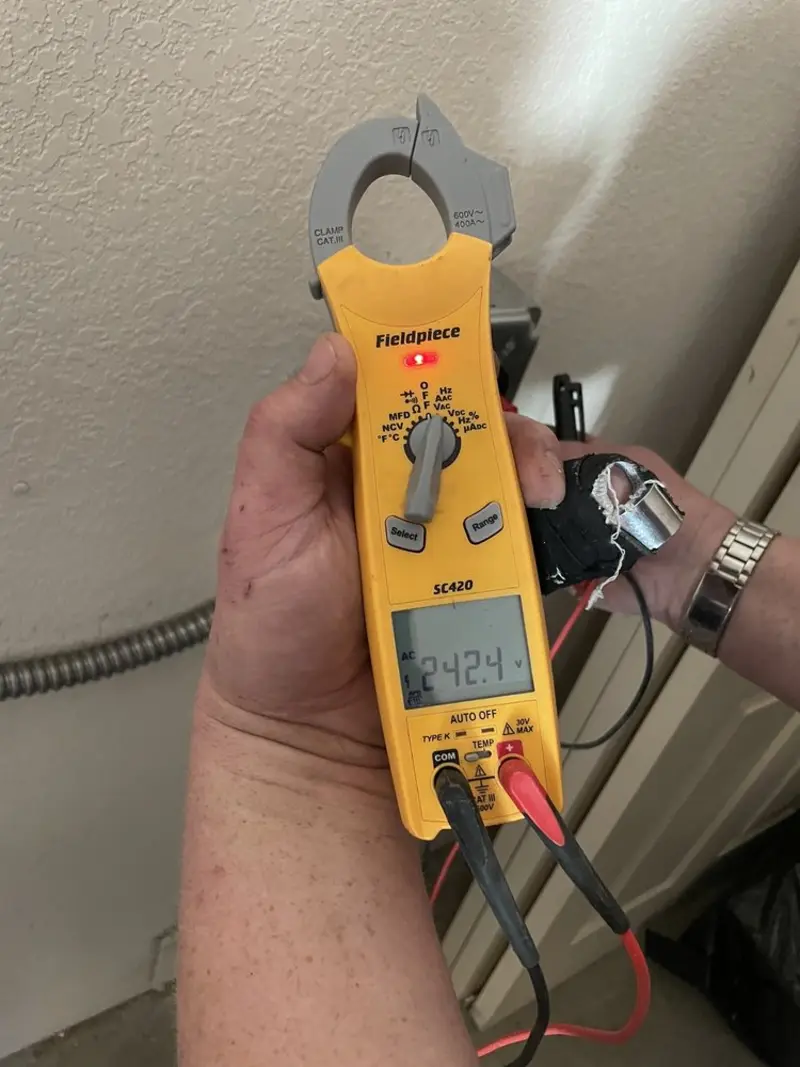 Voltage testing with clamp meter during Electrical Installation Services in Orange Cove